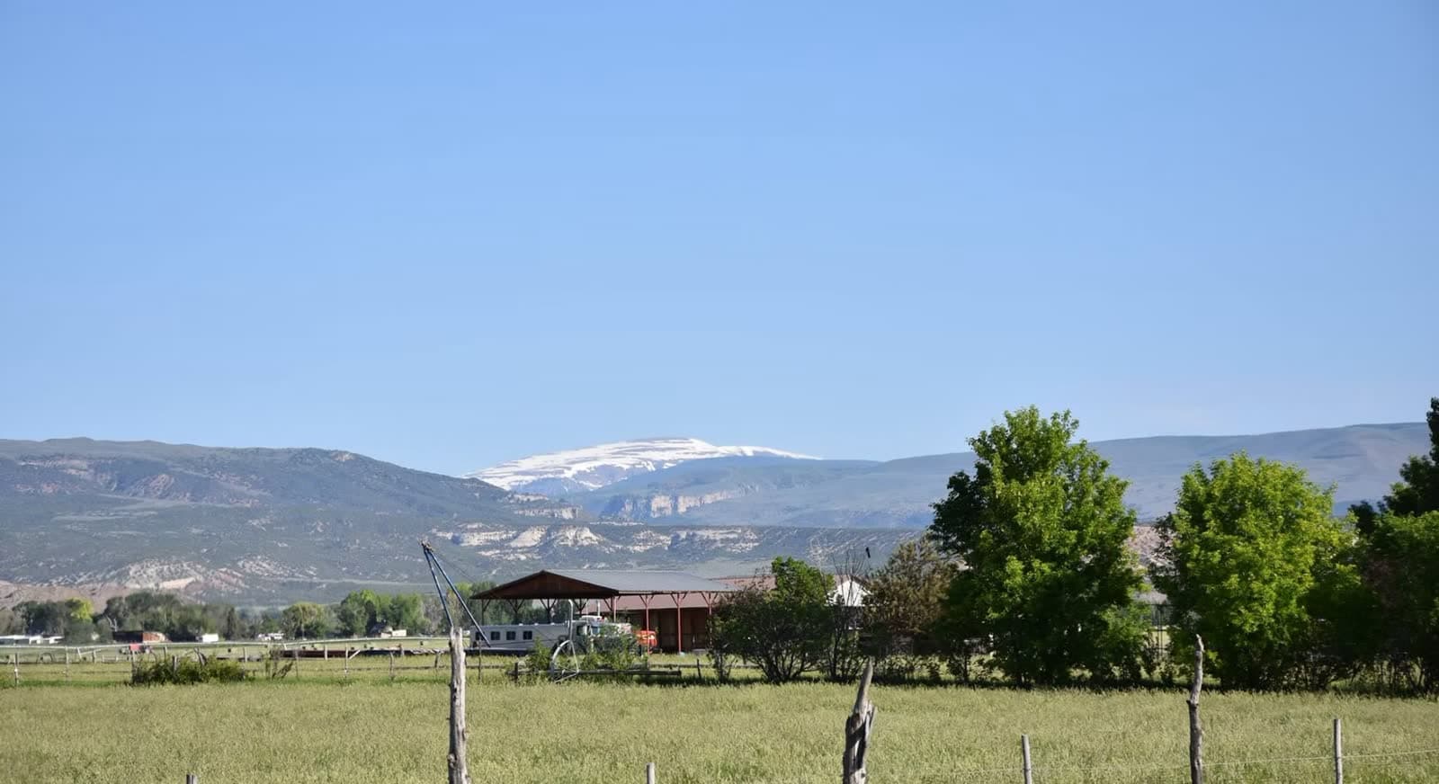 The pistol and rimfire range shed against the snow-capped Uintah peaks and red rock cliffs.